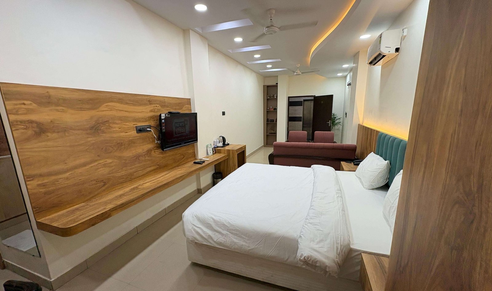 Suite Room Hotel Flora Haridwar - bedroom and TV unit